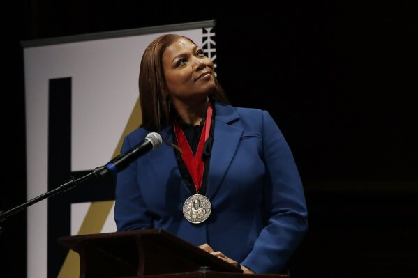Music artist and actress Queen Latifah reacts after receiving the W.E.B. Dubois Medal for her contributions to black history and culture during ceremonies at Harvard University, Tuesday, Oct. 22, 2019, in Cambridge, Mass. (AP Photo/Elise Amendola)