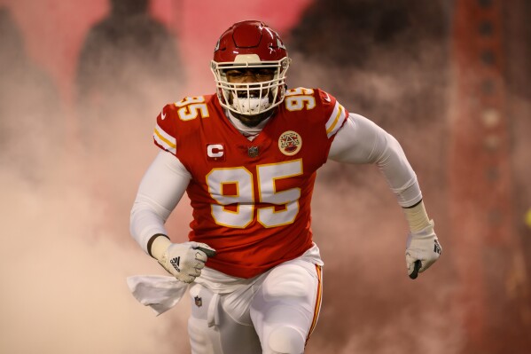 FILE - Kansas City Chiefs defensive tackle Chris Jones comes onto the field during introductions before playing the Cincinnati Bengals in the NFL AFC Championship playoff football game, Sunday, Jan. 29, 2023 in Kansas City, Mo. The negotiations between the Kansas City Chiefs and Chris Jones appear to be getting more contentious by the day, and chances are growing that the Super Bowl champions will begin their title defense without the All-Pro defensive tackle. (AP Photo/Reed Hoffmann, File)