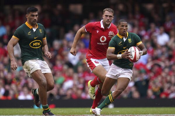 FILE - South Africa's Manie Libbok breaks clear, during the Summer Nations Series match between Wales and South Africa at the Principality Stadium, in Cardiff, on Aug. 19, 2023. This Rugby World Cup was always the ultimate goal for the Springboks coaching combination of Rassie Erasmus and Jacques Nienaber, who sat down soon after taking over a struggling team in early 2018 and began plotting a five-year plan to build a squad for France 2023. (David Davies/PA via AP, File)
