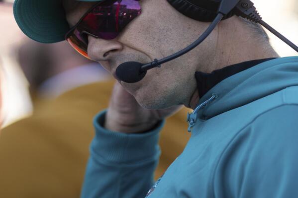 Coastal Carolina head coach Jamey Chadwell talks over his headset during the first half of an NCAA college football game against James Madison in Harrisonburg, Va., Saturday, Nov. 26, 2022. (Daniel Lin/Daily News-Record via AP)