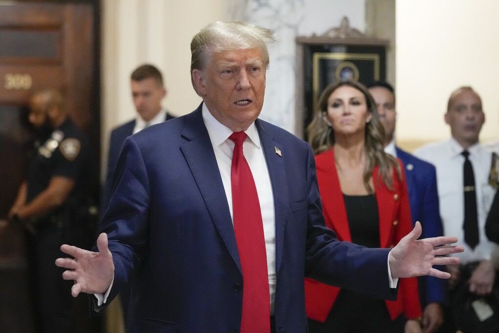 Former President Donald Trump speaks to the media before entering the courtroom at New York Supreme Court, Tuesday, Oct. 3, 2023, in New York. (AP Photo/Seth Wenig)