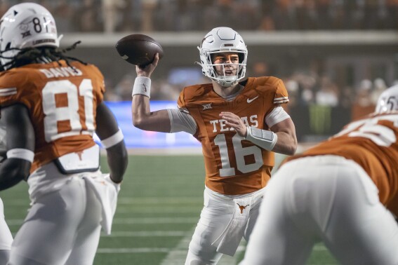 Texas quarterback Arch Manning looks for a receiver during the second half of the team's NCAA college football game against Texas Tech, Friday, Nov. 24, 2023, in Austin, Texas. (AP Photo/Michael Thomas)
