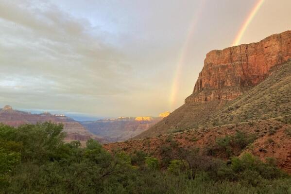 This August 2022 photo provided by the National Park Service shows a double rainbow from the ranger station porch at Indian Garden, which is now called Havasupai Gardens, in Grand Canyon National Park. The Indian Garden name assigned to a popular Grand Canyon campground has been changed out of respect for a Native American tribe that was displaced by the national park. The Havasupai Tribe and Grand Canyon National Park announced Monday, Nov. 21, that Indian Garden will be renamed Havasupai Gardens. (National Park Service via AP)