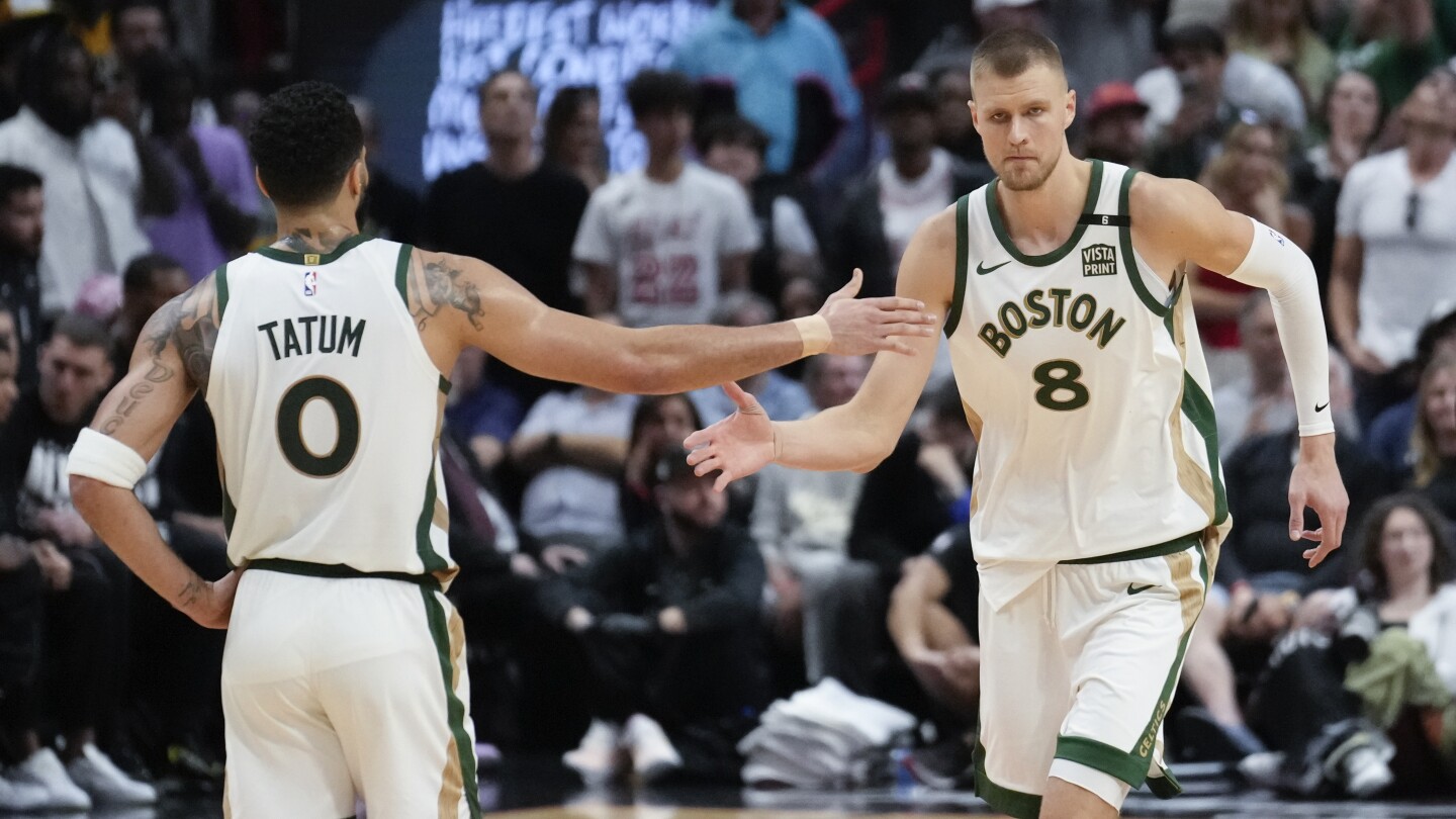 Tatum scored 26 points as the Celtics beat the Heat 110-106