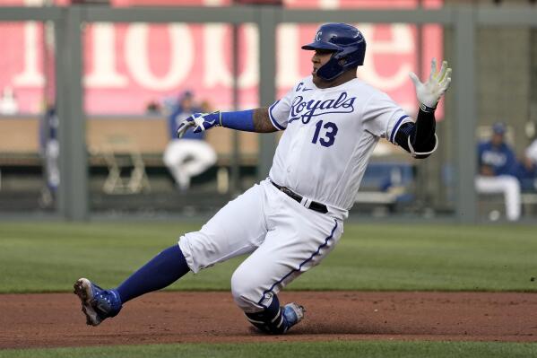 Kansas City Royals' Salvador Perez slides to second after hitting an RBI double during the first inning of a baseball game against the Chicago White Sox Wednesday, May 10, 2023, in Kansas City, Mo. (AP Photo/Charlie Riedel)