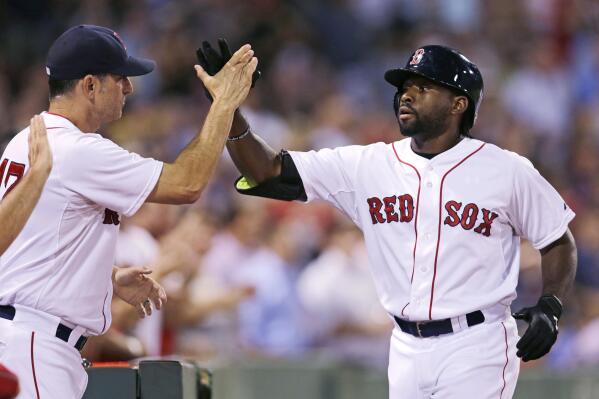 Boston Red Sox's Jackie Bradley Jr., right, is congratulated by Boston Red Sox interim manager Torey Lovullo after his three-run home run off Cleveland Indians starting pitcher Corey Kluber during the fourth inning of a baseball game at Fenway Park in Boston, Wednesday, Aug. 19, 2015. (AP Photo/Charles Krupa)
