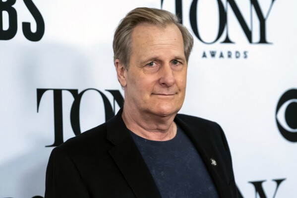 FILE - Jeff Daniels arrives at the 73rd annual Tony Awards "Meet the Nominees" press day in New York on May 1, 2019. Daniels was nominated for a Tony Award for his role in the play, "To Kill a Mockingbird," adapted from the Harper Lee novel. Daniels tackles his life and career in an absorbing, unconventional way this month with a music-and skit-filled audio memoir from Audible, "Alive and Well Enough." (Photo by Charles Sykes/Invision/AP, File)