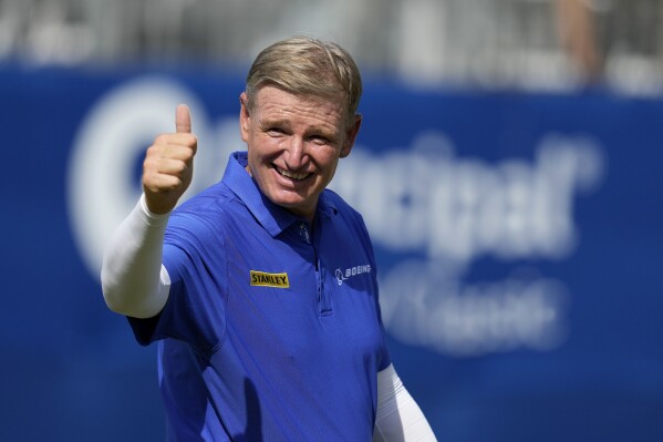 Ernie Els celebrates on the 18th green after winning the Champions Tour Principal Charity Classic golf tournament, Sunday, June 2, 2024, in Des Moines, Iowa. (AP Photo/Charlie Neibergall)