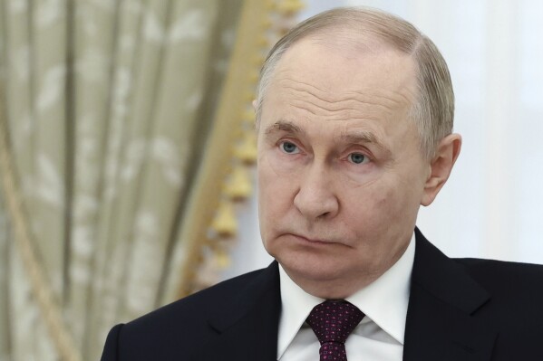 Russian President Vladimir Putin listens to Iranian Foreign Minister Abbas Araghchi during their talks at the Kremlin in Moscow, Russia, Monday, June 23, 2025. (Alexander Kazakov, Sputnik, Kremlin Pool Photo via AP)
