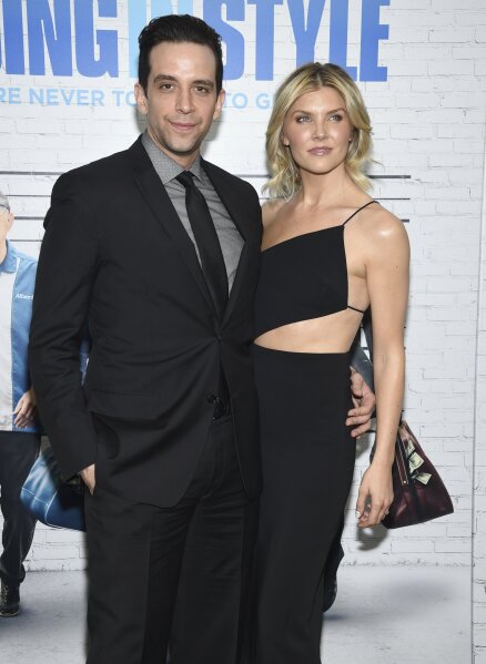 FILE - In this March 30, 2017, file photo, actor Nick Cordero, left, and Amanda Kloots attend the premiere of "Going in Style" in New York. Tony Award-nominated actor Cordero, who specialized in playing tough guys on Broadway in such shows as “Waitress,” “A Bronx Tale” and “Bullets Over Broadway,” has died in Los Angeles after suffering severe medical complications after contracting the coronavirus. He was 41. Cordero died Sunday, July 5, 2020, at Cedars-Sinai hospital after more than 90 days in the hospital, according to his wife, Amanda Kloots. (Photo by Evan Agostini/Invision/AP, File)