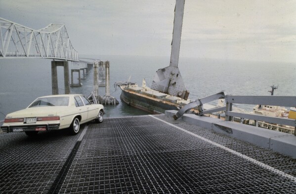 FILE - A car is halted at the edge of the Sunshine Skyway Bridge across Tampa Bay, Fla., after the freighter Summit Venture struck the bridge during a thunderstorm and tore away a large part of the span, May 9 1980. A container ship struck a major bridge in Baltimore early Tuesday, March 26, 2024, causing it to plunge into the river below. From 1960 to 2015, there have been 35 major bridge collapses worldwide due to ship or barge collision. (AP Photo/Jackie Green, File)