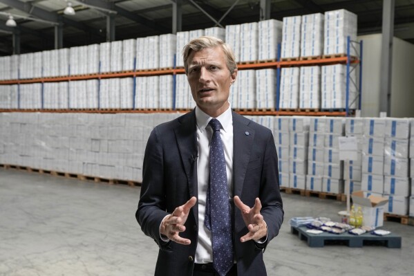 Carl Skau, deputy executive director of the U.N. World Food Program (WFP), speaks during an interview with The Associated Press as he tours a WFP warehouse stocking food rations in the northern Beirut suburb of Dekwaneh, Lebanon, Wednesday, May 8, 2024. If the monthslong conflict playing out on the Lebanese-Israeli border continues to escalate, the United Nations food agency won't be ready for the spike in nutritional needs across crisis-hit Lebanon, its deputy executive director said Wednesday. (AP Photo/Bilal Hussein)