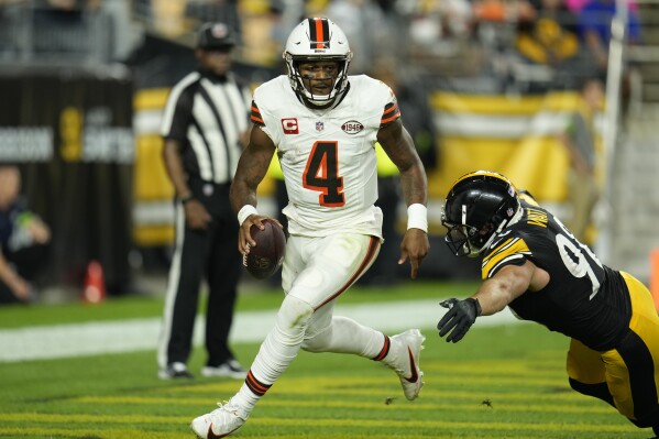Cleveland Browns quarterback Deshaun Watson is chased by Pittsburgh Steelers linebacker T.J. Watt during the first half of an NFL football game Monday, Sept. 18, 2023, in Pittsburgh. (AP Photo/Gene J. Puskar)