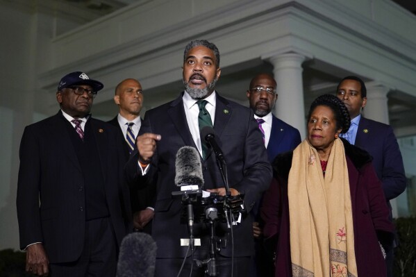 FILE - Congressional Black Caucus chair Rep. Steven Horsford, D-Nev., center, talks with reporters following a meeting with President Joe Biden at the White House in Washington, Thursday, Feb. 2, 2023. Horsford is joined by, from left, Rep. James Clyburn, D-S.C., Sen. Cory Booker, D-N.J., Sen. Raphael Warnock, D-Ga., Rep. Sheila Jackson Lee, D-Texas, and Rep. Joe Neguse, D-Colo. The Congressional Black Caucus is pushing the White House, Justice Department and the Department of Education to adopt an “aggressive legal strategy” to scrutinize recent changes to Florida's Black history curriculum. (AP Photo/Susan Walsh, File)