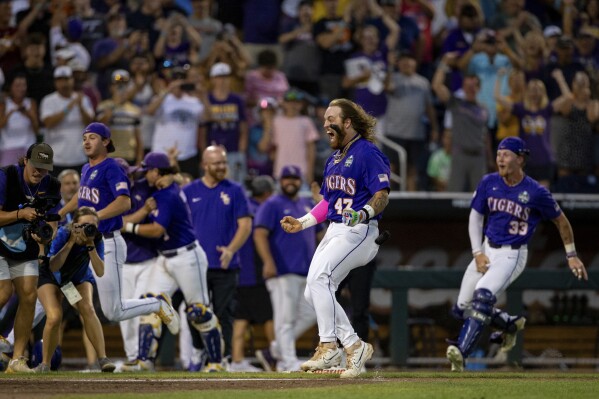 FILE - LSU's Tommy White (47) runs home after hitting a walk-off home run against Wake Forest in the 11th inning in a baseball game at the NCAA College APSeries in Omaha, Neb., Thursday, June 22, 2023. (APPhoto/John Peterson, File)