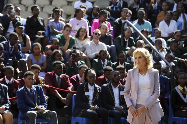 U.S. First lady Jill Biden, right, greets students while on a visit to the University of Science and Technology in Windhoek, Namibia Friday, Feb. 24, 2023. Biden told the young people that the democracy their parents and grandparents fought for is now theirs to defend and protect. (AP Photo/Dirk Heinrich)