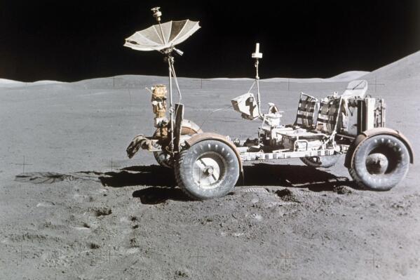 FILE - Rover alone, looking north, on the west edge of Mount Hadley is at upper right edge of picture, the most distant lunar feature visible is about 25 kilometers away, Aug. 1971.  Goodyear is teaming with Lockheed Martin on the development of a vehicle planned for use on the moon, providing airless tires for the project. This isn't Goodyear's first venture into space, as it supplied essential products for NASA's Apollo program, including the Apollo 11 mission.  (AP Photo, File)