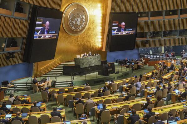 Live video monitors show United Nations Ambassador from Russia, Vasily Nebenzya, addressing the U.N. General Assembly before a vote on a resolution condemning Russia's illegal referendum in Ukraine, Wednesday Oct. 12, 2022 at U.N. headquarters. (AP Photo/Bebeto Matthews)