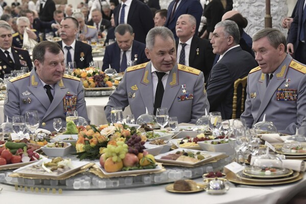 FILE - Deputy Defense Minister Dmitry Bulgakov, left, Defence Minister Sergei Shoigu, center, and Chief of the General Staff Valery Gerasimov attend the reception to mark the Day of the Heroes, at the Moscow's Kremlin, Russia, on Wednesday, Dec. 11, 2019. Former Deputy Defense Minister Gen. Dmitry Bulgakov was detained in Moscow and ordered held in custody pending an investigation and trial, Russia's Investigative Committee said Friday, July 26, 2024, without giving further details. (Alexei Nikolsky, Sputnik, Kremlin Pool Photo via ĢӰԺ, File)