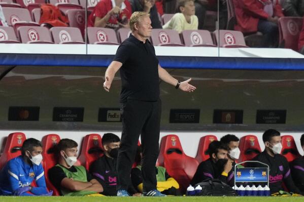 Barcelona's head coach Ronald Koeman reacts during a Group E Champions League soccer match between Benfica and Barcelona at the Luz stadium in Lisbon, Portugal, Wednesday, Sept. 29, 2021. (AP Photo/Armando Franca)