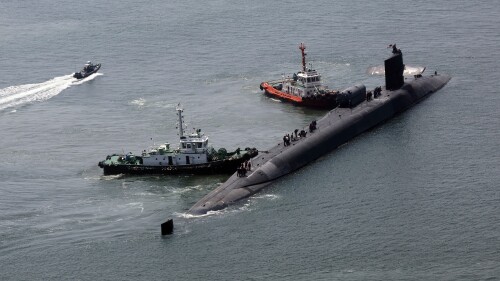 The nuclear-powered submarine USS Michigan approaches a naval base in Busan, South Korea, Friday, June 16, 2023. The United States deployed the nuclear-powered submarine capable of carrying about 150 Tomahawk missiles to South Korea on Friday, a day after North Korea resumed missile tests in protest of the U.S.-South Korean live-fire drills. (Gang Duck-chul/Yonhap via AP)