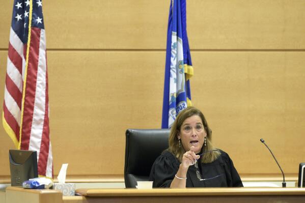Superior Court Judge Barbara Bellis speaks with the attorneys during the Alex Jones Sandy Hook defamation damages trial in Superior Court in Waterbury, Conn., on Thursday, Oct. 2022. (H John Voorhees III/Hearst Connecticut Media via AP, Pool)