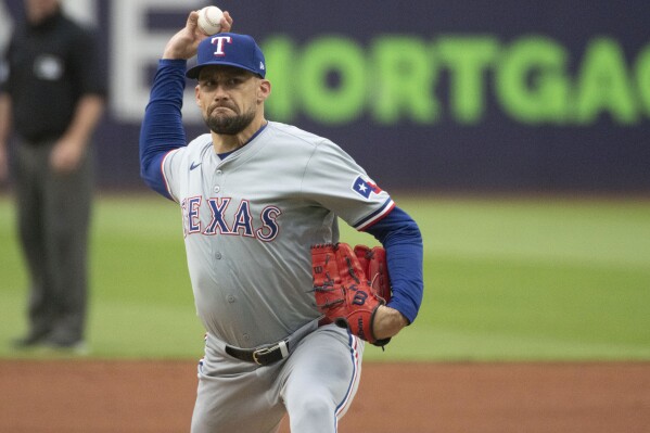 Texas Rangers starting pitcher Nathan Eovaldi delivers against the Cleveland Guardians during the first inning of a baseball game in Cleveland, Friday, Aug. 23, 2024. (AP Photo/Phil Long, File)