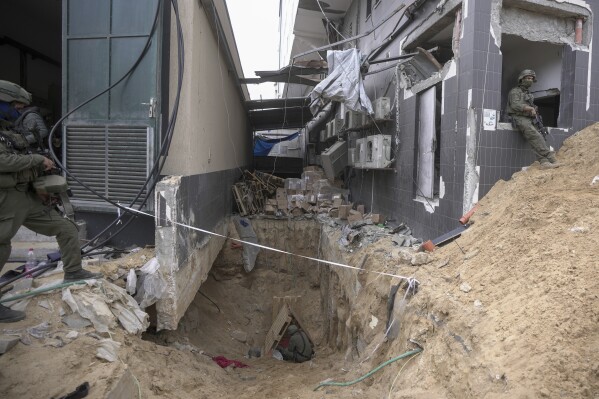 UPDATES INSTRUCTIONS - Israeli soldiers show the media an underground tunnel found underneath Shifa Hospital in Gaza City, Wednesday, Nov. 22, 2023. Israel says that Hamas militants sought cover on the grounds of the hospital and used the tunnel for military purposes. (AP Photo/Victor R. Caivano)