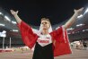 FILE - Canada's Shawn Barber celebrates after winning the gold medal in the men's pole vault final at the World Athletics Championships at the Bird's Nest stadium in Beijing, Monday, Aug. 24, 2015. Barber has died from medical complications. He was 29. Barber died Wednesday, Jan. 17, 2024, at home in Kingwood, Texas, his agent, Paul Doyle, confirmed to The Associated Press.(Christian Charisius/dpa via AP, File)