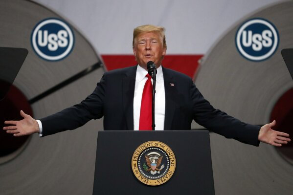 FILE - In this July 26, 2018, file photo President Donald Trump speaks at the United States Steel Granite City Works plant in Granite City, Ill.  Trump spent four years upending seven decades of American trade policy. He started a trade war with China, slammed America’s closest allies by taxing their steel and aluminum and terrified Big Business by threatening to take a wrecking ball to $1.4 trillion in annual trade with Mexico and Canada. Trump’s legacy on trade is likely to linger, regardless whether Joe Biden replaces him in the White House in January 2021. (AP Photo/Jeff Roberson, File)
