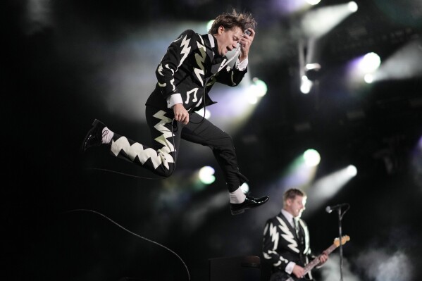 Lead singer Pelle Almqvist of the Swedish garage rock band, The Hives, performs during the Corona Capital music festival in Mexico City, Friday, Nov. 17, 2023. (AP Photo/Eduardo Verdugo)