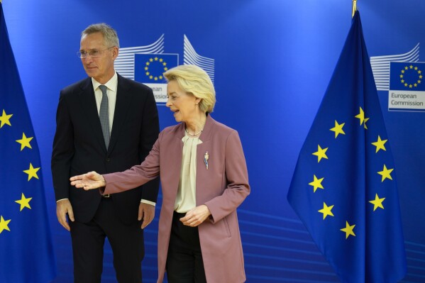 European Commission President Ursula von der Leyen, right, speaks with NATO Secretary General Jens Stoltenberg as they arrive for a meeting of the College of Commissioners at EU headquarters in Brussels, Wednesday, Nov. 15, 2023. (AP Photo/Virginia Mayo)