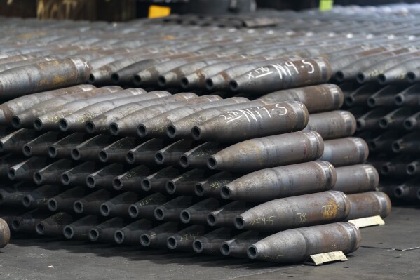 FILE - 155 mm M795 artillery projectiles are stacked during manufacturing process at the Scranton Army Ammunition Plant in Scranton, Pa., Thursday, April 13, 2023. The Pentagon could get weapons moving to Ukraine within days if Congress passes a long-delayed aid bill. That's because it has a network of storage sites in the U.S. and Europe that already hold the ammunition and air defense components that Kyiv desperately needs. The House approved $61 billion in funding for the war-torn country Saturday, April 20, 2024. (AP Photo/Matt Rourke, File)