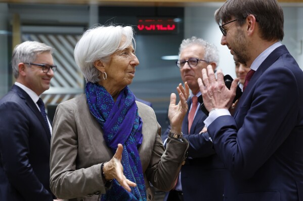 European Central Bank President Christine Lagarde, left, speaks with Netherland's Finance Minister Steven Van Weyenberg during a roundtable meeting of eurogroup finance ministers at the European Council building in Brussels, Monday, Jan. 15, 2024. Eurogroup finance ministers on Monday will discuss, among other issues, competitiveness, energy prices and the 2024 work program. (AP Photo/Geert Vanden Wijngaert)