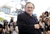 FILE - Actor Gerard Depardieu poses for photographers during a photo call for the film Valley of Love, at the 68th international film festival, Cannes, southern France, Friday, May 22, 2015. The Grevin Museum of wax figures Paris has removed the wax figure of French actor Gerard Depardieu due to negative reactions from visitors, the museum said Monday.  (AP Photo/Thibault Camus, file)