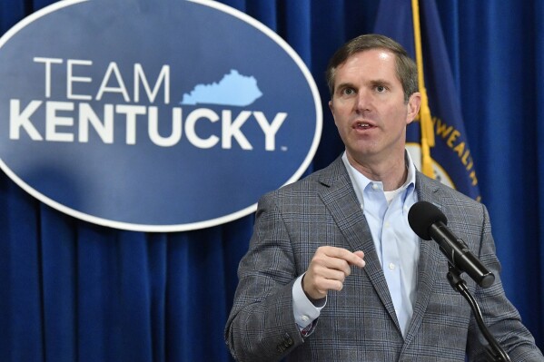 FILE - Kentucky Gov, Andy Beshear speaks in the Rotunda of the Kentucky State Capitol in Frankfort, Ky., Tuesday, March 26, 2024. With a stroke of his pen, Kentucky Gov. Andy Beshear took action Thursday to designate Juneteenth as a holiday for state executive branch workers and expand protections in state hiring and employment by banning discrimination based on hairstyles. (AP Photo/Timothy D. Easley, file)