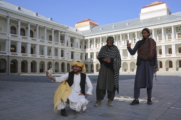 Afghans take selfies at the renovated Darul Aman Palace in Kabul, Afghanistan, Wednesday, April 24, 2024. (AP Photo/Siddiqullah Alizai)