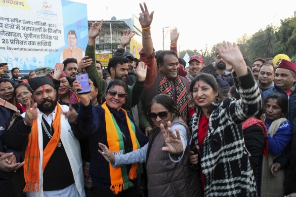 India's Bharatiya Janata Party supporters celebrate after Uttarakhand state lawmakers passed a uniform marriage law for all religions in Dehradun, India, Wednesday, Feb.7, 2024. The northern Indian state on Wednesday approved an unprecedented uniform code for marriage, divorce, adoption and inheritance for Hindus, Muslims and other religious communities under a new law that also requires couples that live together to register with the government or face punishment. (AP Photo)