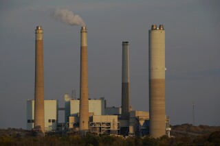 AES Indiana Petersburg Generating Station, a coal-fired power plant, operates in Petersburg, Ind., on Wednesday, Oct. 25, 2023. (AP Photo/Joshua A. Bickel)