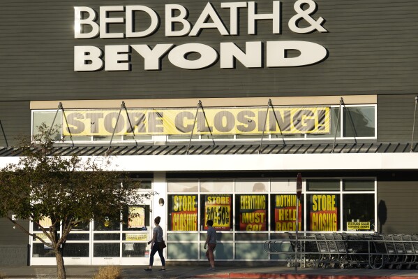 Shoppers enter exit a Bed Bath & Beyond store Monday, May 29, 2023, in Glendale, Colo. Overstock.com is dumping its name online and becoming Bed Bath & Beyond. The news, announced Wednesday, June 28, comes as a federal bankruptcy court approved the online retailer’s bid to buy the bankrupt retailer’s intellectual property assets for $21.5 million. (AP Photo/David Zalubowski)