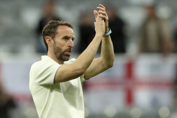 FILE -England coach Gareth Southgate applauds the fans at the end of an international friendly soccer match between England and Bosnia and Herzegovina at St. James Park in Newcastle, England, Monday, June 3, 2024. With four of the hottest forwards in European soccer, England has no shortage of firepower as it looks to end a near-60-year wait for silverware. (AP Photo/Scott Heppell, File)