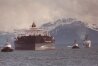 In this June 23, 1989 file photo. the Exxon Valdez is pictured being towed out of Prince William Sound in Alaska by a tug boat and a U.S. Coast Guard Cutter. (AP Photo/Al Gillo, File)