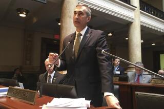 FILE- Republican state Sen. David Givens, of Greensburg, argues in favor of a bill allowing charter schools on Wednesday, March 15, 2017, in Frankfort, Ky. With Kentucky Republicans suddenly in charge of deciding how the state will respond to the surging COVID-19 pandemic, Givens is hinting at one policy direction: decisions about mask mandates are best left to local officials. Senate President Pro Tem Givens mentioned that approach Monday, Aug. 30, 2021, as GOP lawmakers consider possible actions to be considered in an anticipated special legislative session. (AP Photo/Adam Beam, File)