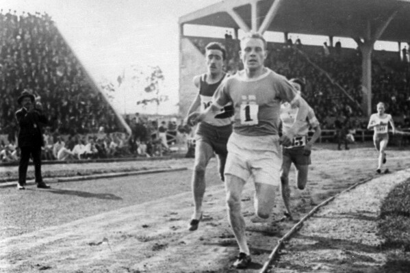 FILE - Paavo Nurmi, of Finland, leads the field during a track at the 1924 Olympics in Paris on July 1924. The five Olympic gold medals won by Finnish running great Paavo Nurmi will be returned to Paris and displayed at an exhibition next month marking the century of his unique achievement at the 1924 Paris Games, World Athletics said Monday, Feb. 26, 2024. (AP Photo, File)