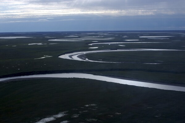 This July 8, 2004, photo provided by the United States Geological Survey shows Fish Creek through the National Petroleum Reserve-Alaska, managed by the Bureau of Land Management on Alaska's North Slope. (David W. Houseknecht/United States Geological Survey via AP)