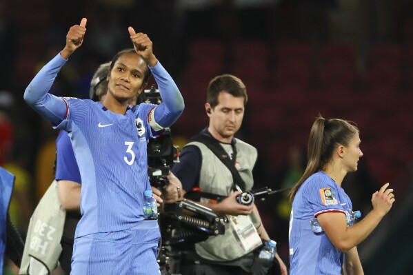 France's Wendie Renard gestures to the crowd following the Women's World Cup Group F soccer match between France and Brazil in Brisbane, Australia, Saturday, July 29, 2023. (AP Photo/Tertius Pickard)