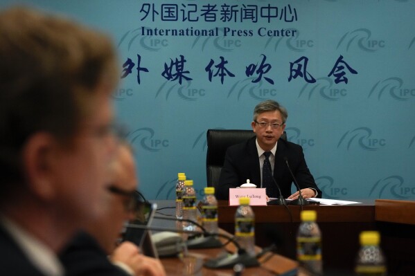 Director General of the Foreign Ministry's European Department Wang Lutong speaks during a press conference at the Ministry of Foreign Affairs office after a meeting between the leaders of China and the European Union in Beijing, Thursday, Dec. 7, 2023. (AP Photo/Andy Wong)