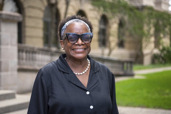 FILE - Kathleen McElroy poses Tuesday, June 13, 2023, in College Station, Texas. Texas A&M University reached a $1 million settlement Thursday, Aug. 3, 2023, with McElroy, a Black journalism professor, after botched attempts to hire her unraveled after pushback over her past work promoting diversity. (Meredith Seaver/College Station Eagle via AP, File)
