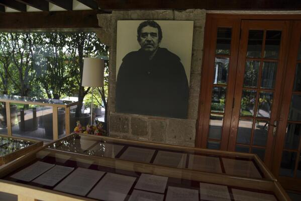 A collection of letters are displayed in a room decorated with a photograph of late Colombian writer Gabriel García Márquez at his home in Mexico City, Wednesday, June 15, 2022. Relatives sorted through the belongings left by the late Colombian Nobel Literature Prize winner Gabriel García Márquez, they found a box marked with the word "grandchildren". The chance discovery revealed to the world more than one hundred unpublished letters that García Márquez received from writer Pablo Neruda, former President Bill Clinton, and actor Robert Redford among others. (AP Photo/Fernando Llano)