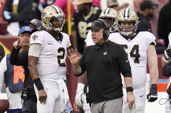 New Orleans Saints head coach Sean Payton speaks with quarterback Jameis Winston (2) in the second half of an NFL football game against the Washington Football Team, Sunday, Oct. 10, 2021, in Landover, Md. (AP Photo/Julio Cortez)